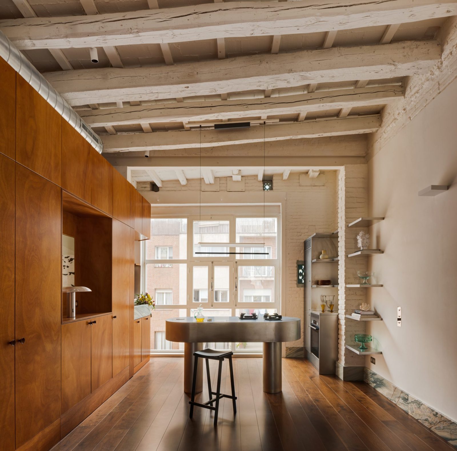 Archisearch Interiors We Love: RiC 12 by Serboli is A Duplex in Barcelona Unfolding Around a Signature Red Spiral Staircase