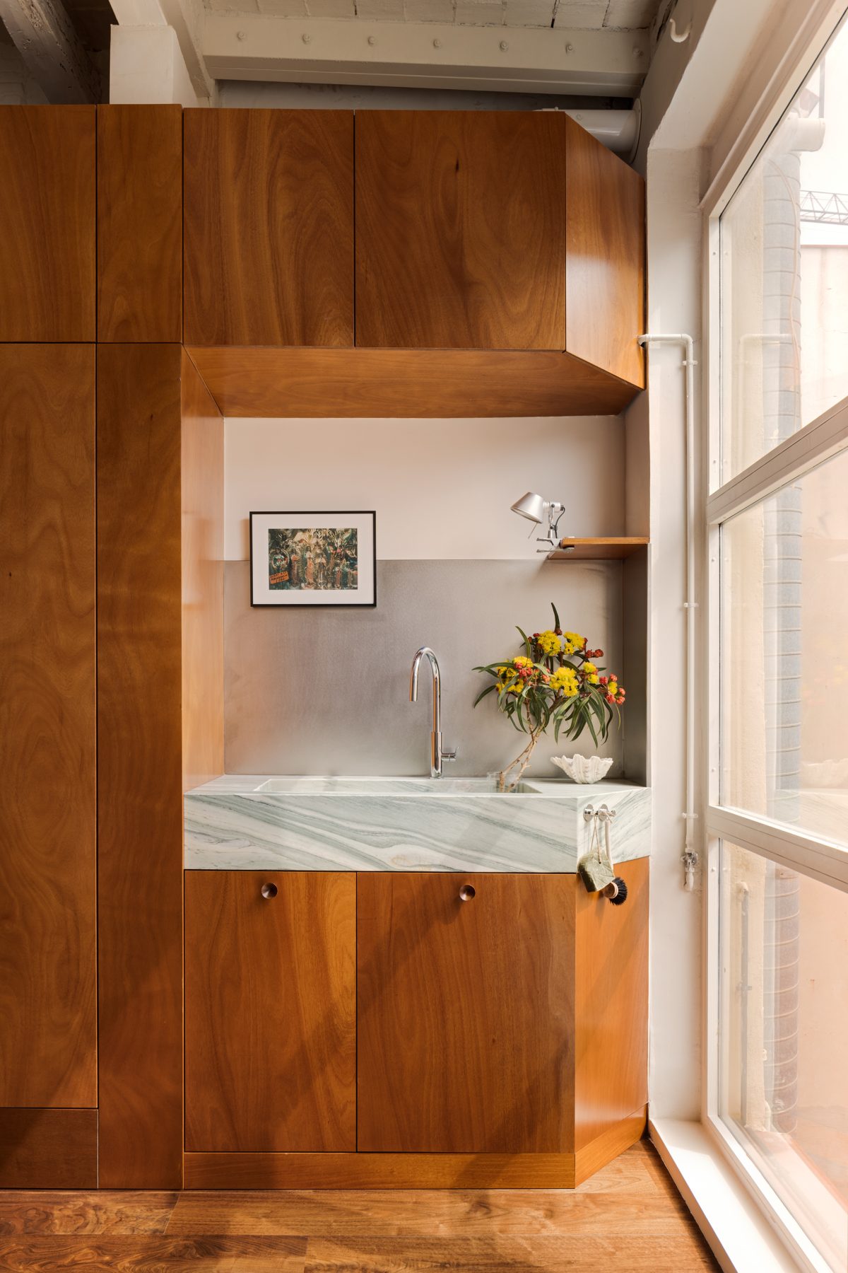 Archisearch Interiors We Love: RiC 12 by Serboli is A Duplex in Barcelona Unfolding Around a Signature Red Spiral Staircase