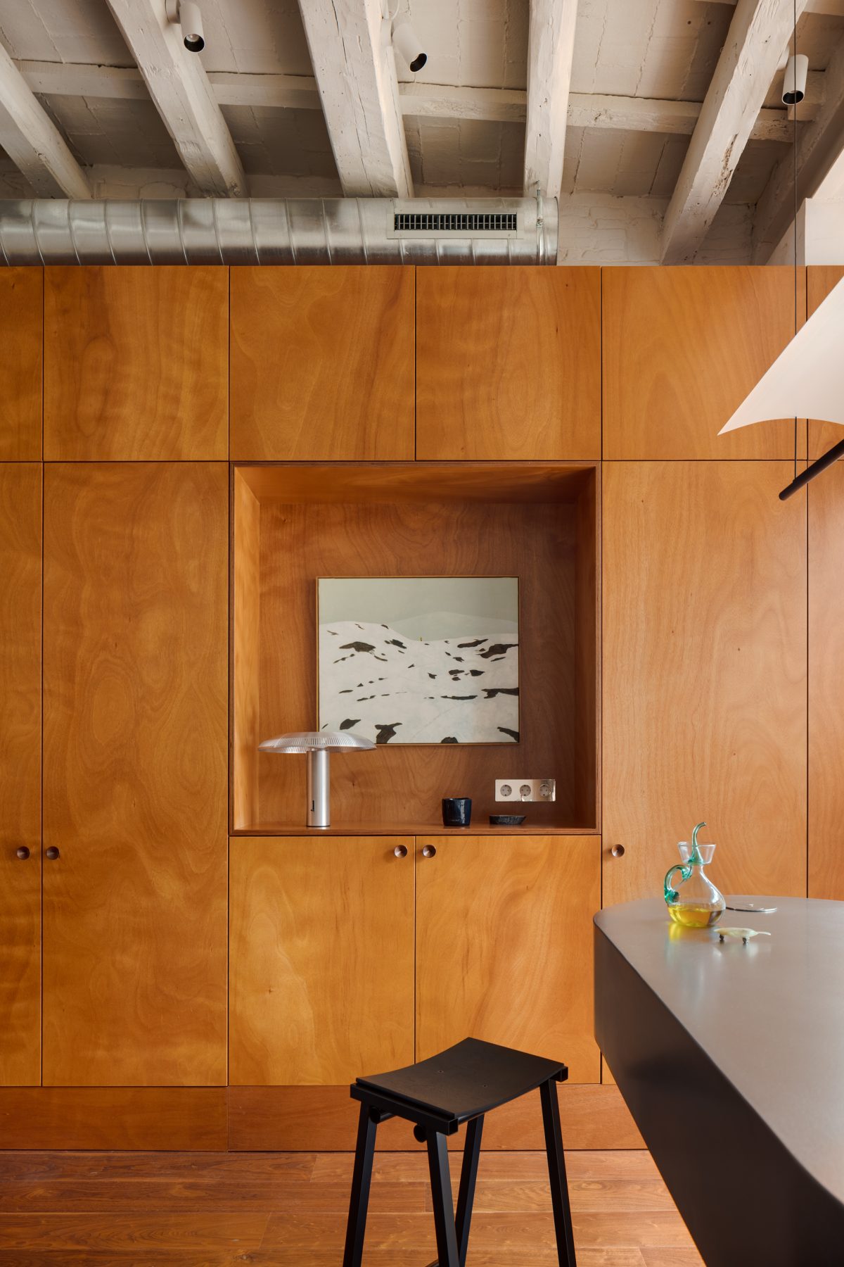 Archisearch Interiors We Love: RiC 12 by Serboli is A Duplex in Barcelona Unfolding Around a Signature Red Spiral Staircase