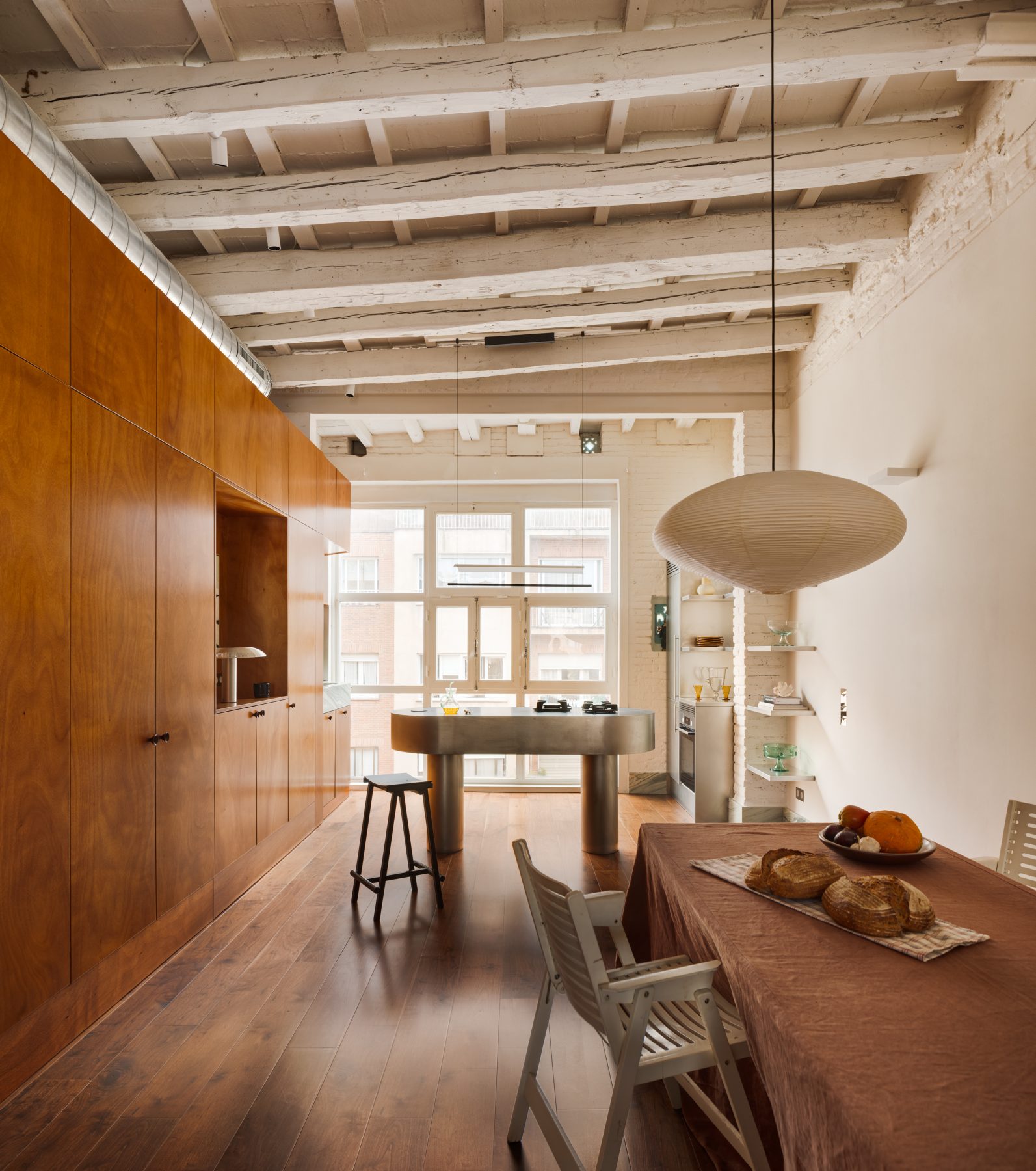 Archisearch Interiors We Love: RiC 12 by Serboli is A Duplex in Barcelona Unfolding Around a Signature Red Spiral Staircase