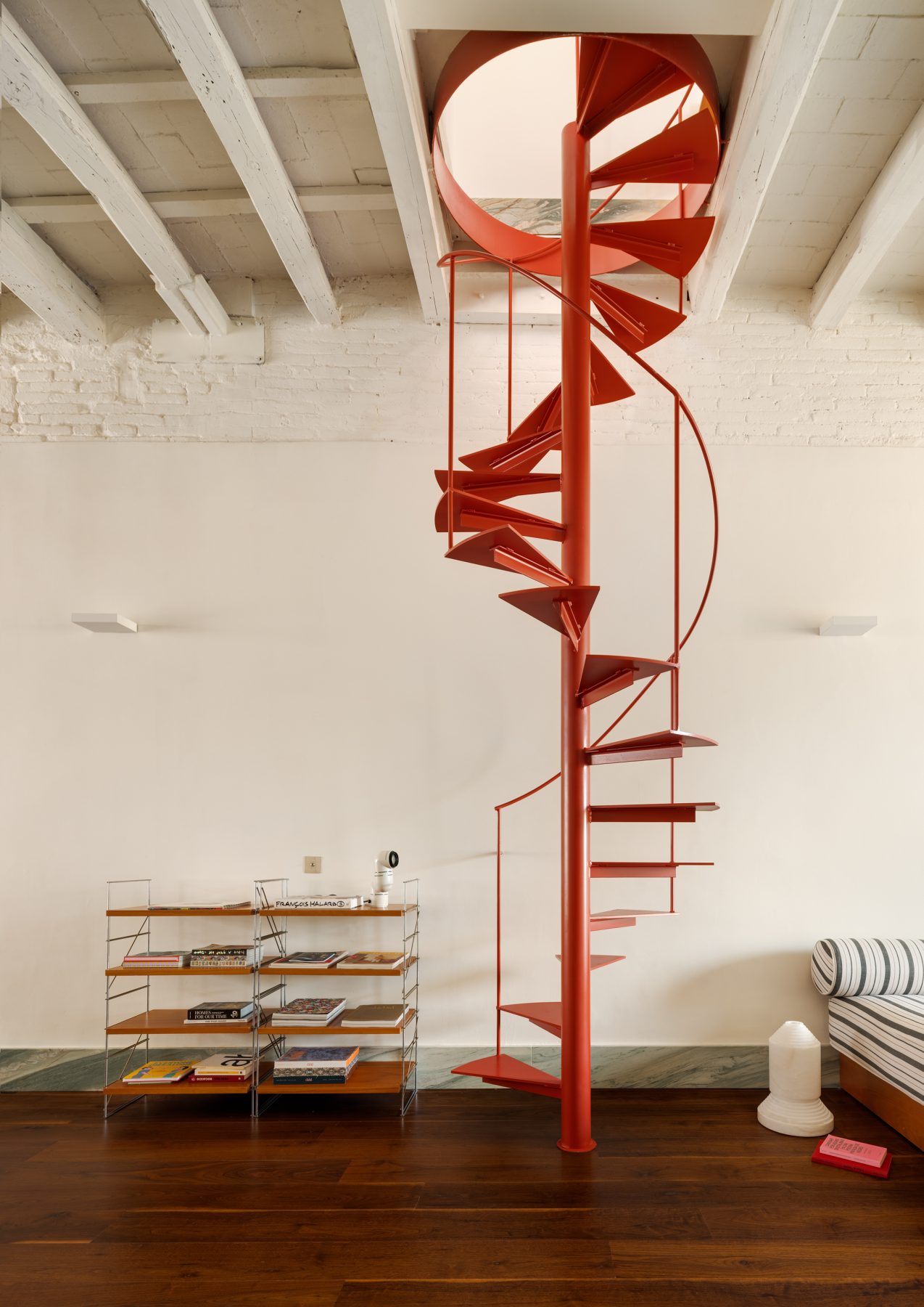Archisearch Interiors We Love: RiC 12 by Serboli is A Duplex in Barcelona Unfolding Around a Signature Red Spiral Staircase