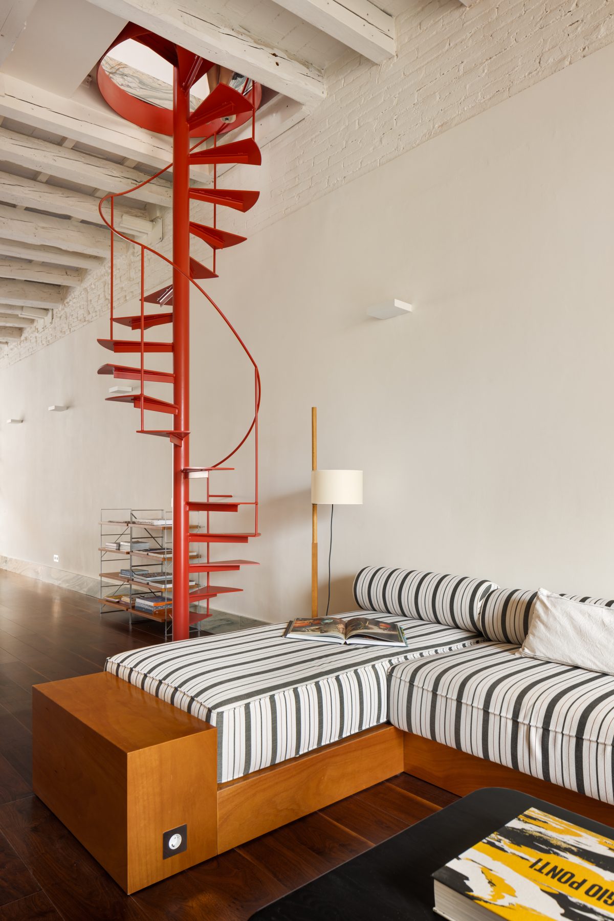 Archisearch Interiors We Love: RiC 12 by Serboli is A Duplex in Barcelona Unfolding Around a Signature Red Spiral Staircase