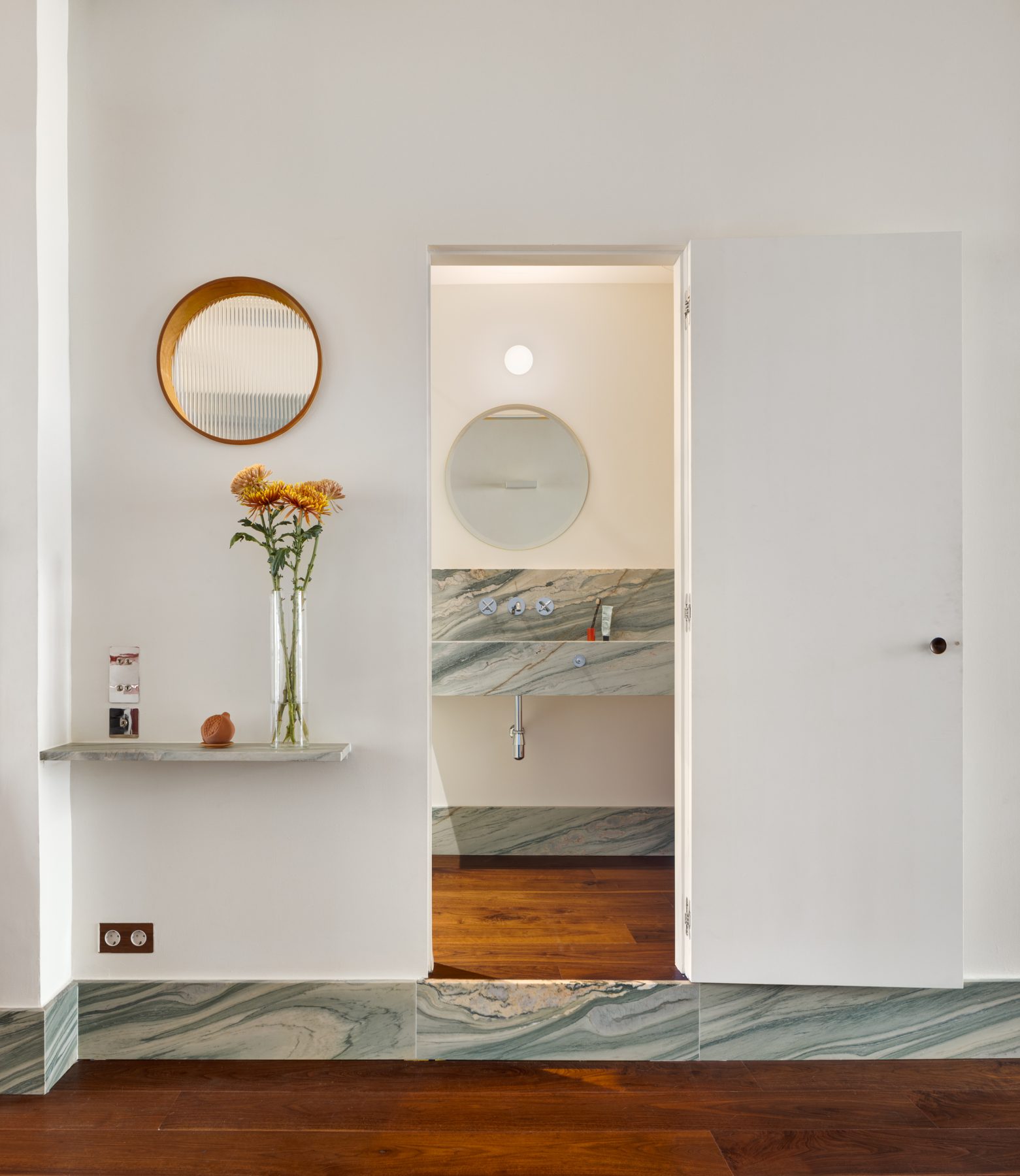 Archisearch Interiors We Love: RiC 12 by Serboli is A Duplex in Barcelona Unfolding Around a Signature Red Spiral Staircase