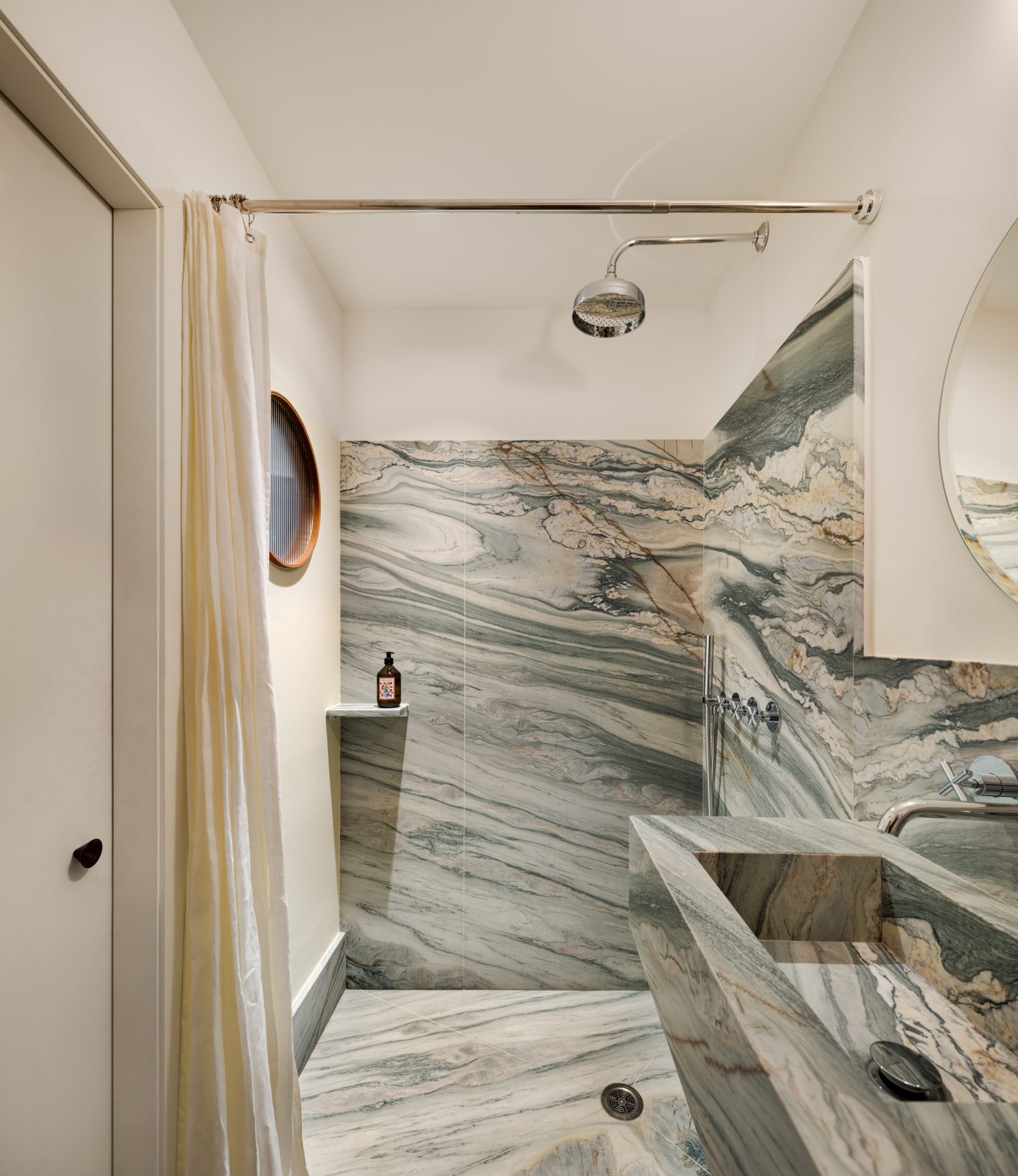 Archisearch Interiors We Love: RiC 12 by Serboli is A Duplex in Barcelona Unfolding Around a Signature Red Spiral Staircase