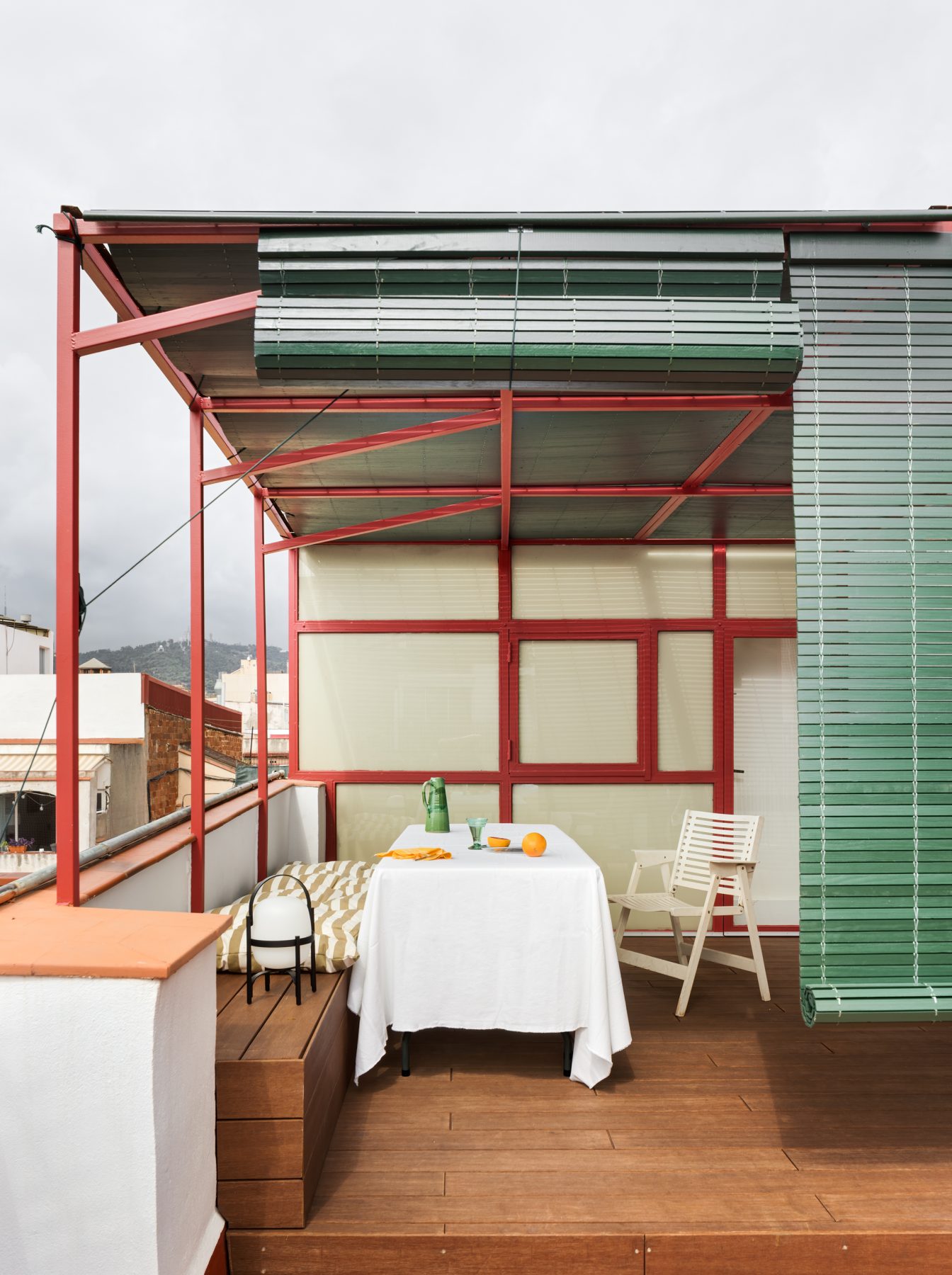 Archisearch Interiors We Love: RiC 12 by Serboli is A Duplex in Barcelona Unfolding Around a Signature Red Spiral Staircase