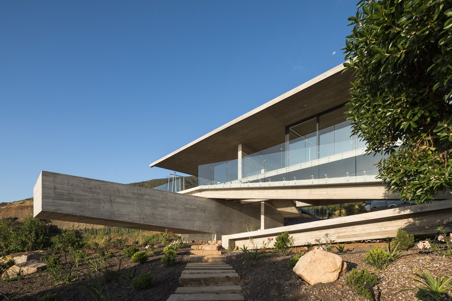 Archisearch Felipe Assadi designed House H as a linear concrete structure levitating over a slope in Chile