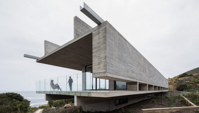 Archisearch - Felipe Assadi designed House H as a linear concrete structure levitating over a slope in Chile
