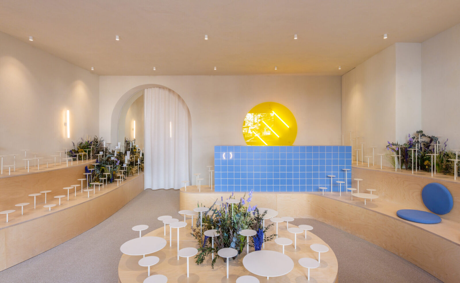 Archisearch Clap Studio recreates an Aster field with real and conceptual flowers at the interior of Septiembre Clinic