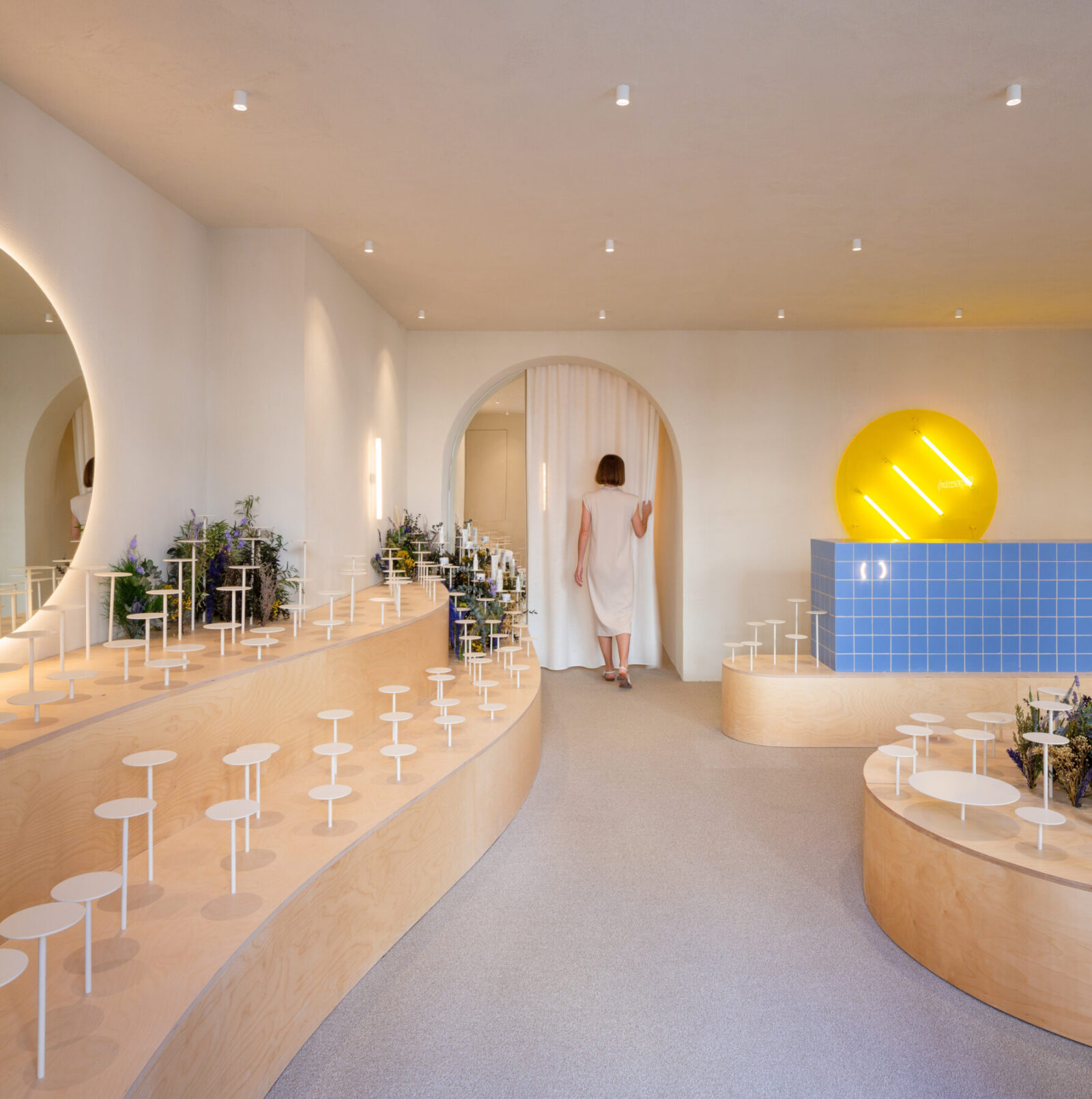 Archisearch Clap Studio recreates an Aster field with real and conceptual flowers at the interior of Septiembre Clinic