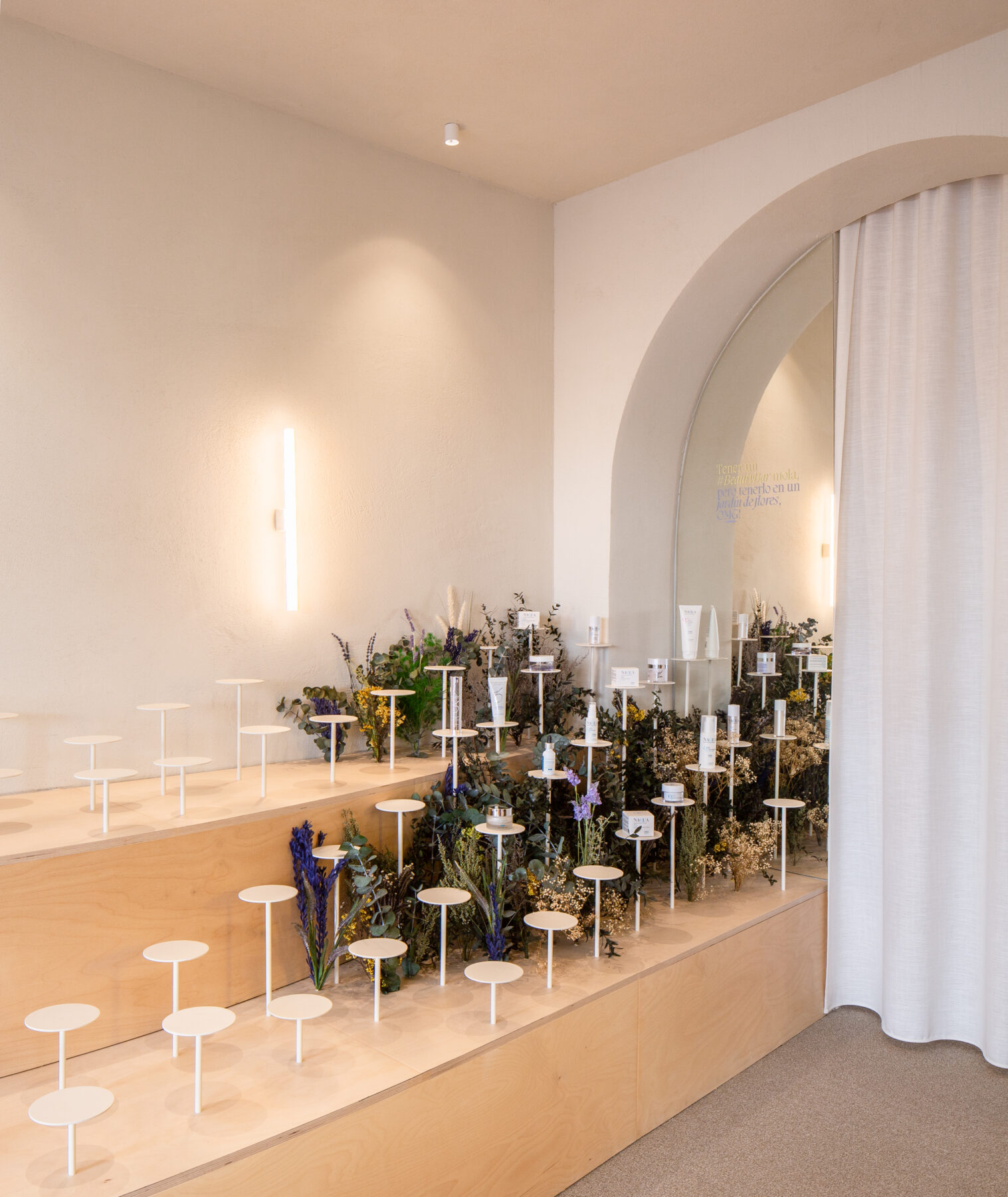 Archisearch Clap Studio recreates an Aster field with real and conceptual flowers at the interior of Septiembre Clinic