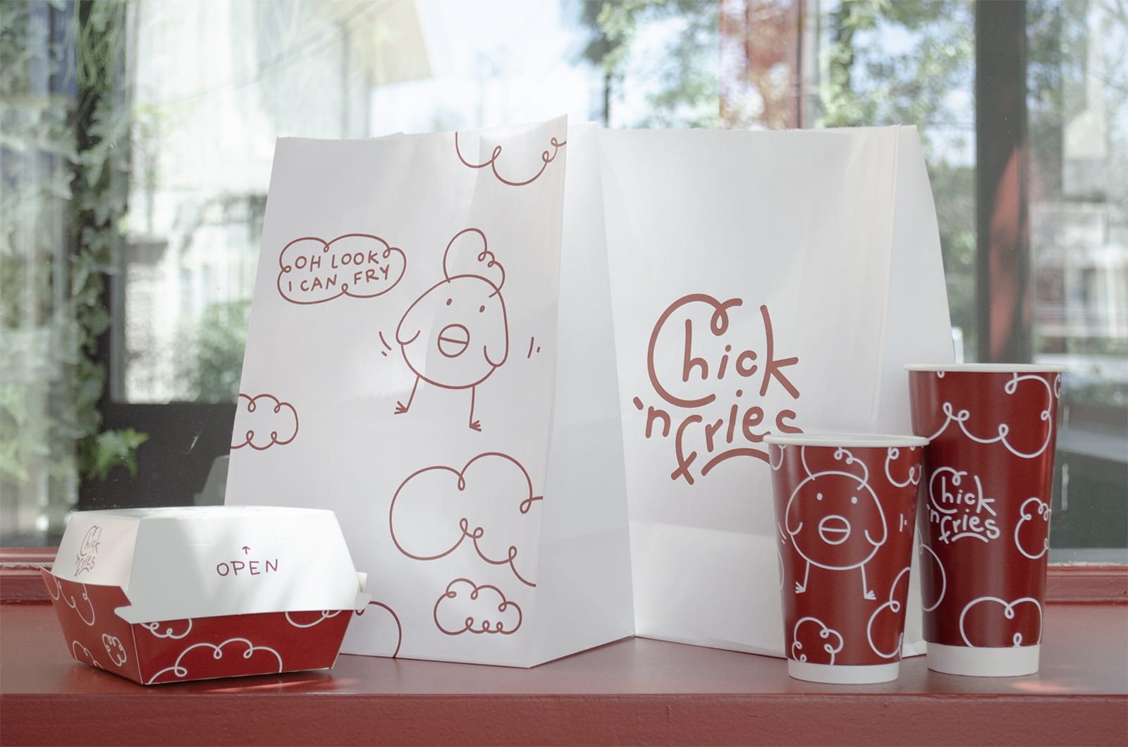 Archisearch Οι Pope σχεδιάζουν το ταχυφαγείο “Chick ’n Fries” στο Μαρούσι σαν μια παιχνιδιάρικη, καθημερινή στάση σε κόκκινο φόντο.