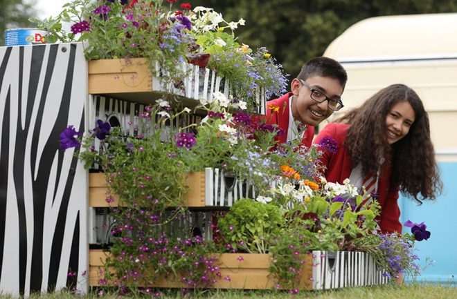 Old furniture being reused as planters for Hampton Court Palace Flower show (Luke MacGregor)
