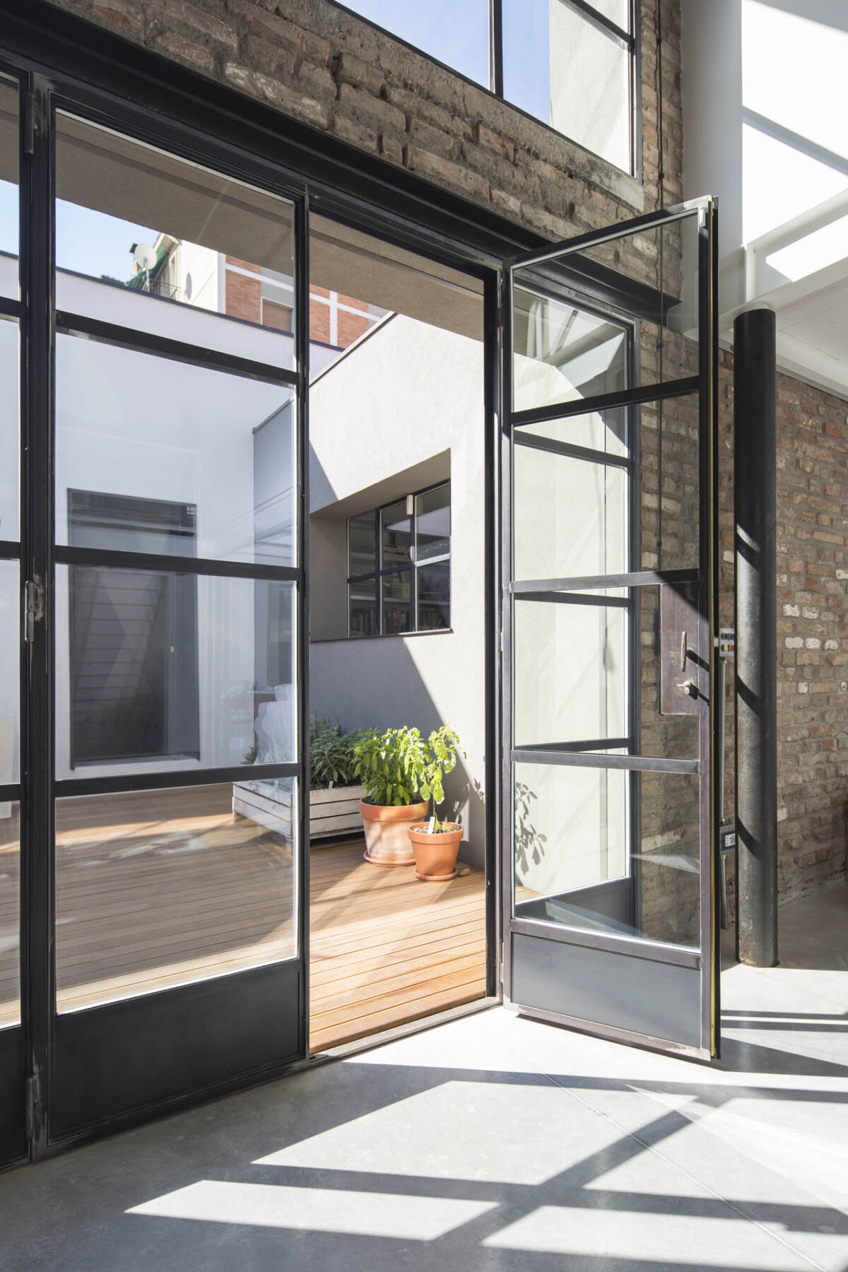 Archisearch Architects Luca Bertacchi & Sara Bergami design a loft in Bologna using FerroFinestra W40 steel system by Ottostumm | Mogs