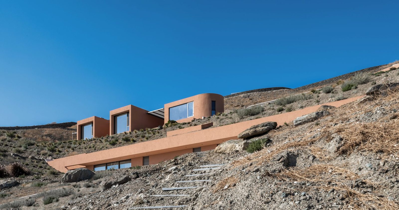 Archisearch Olen in Syros by Ateno is an earth-sheltered retreat in three acts