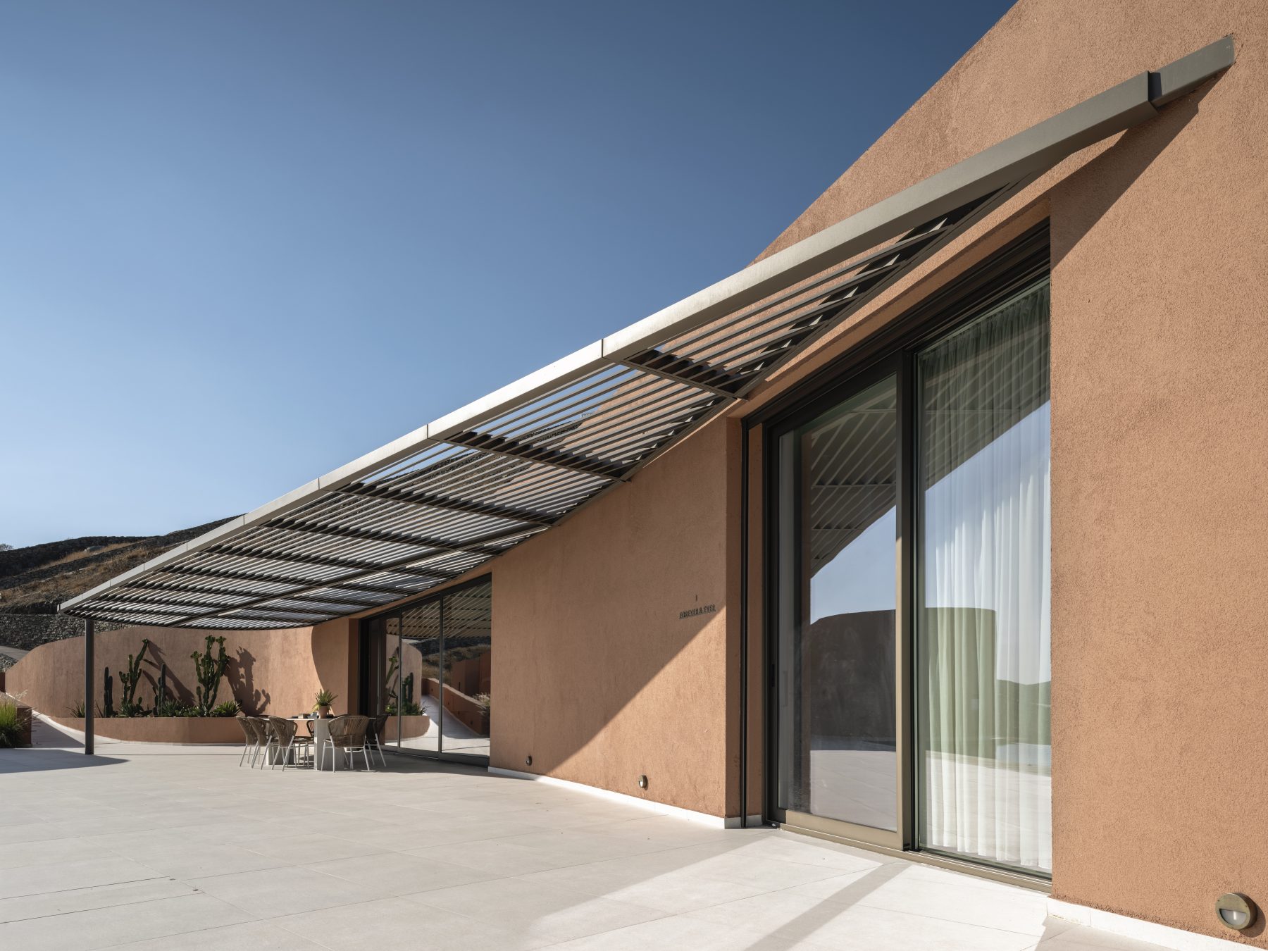 Archisearch Olen in Syros by Ateno is an earth-sheltered retreat in three acts