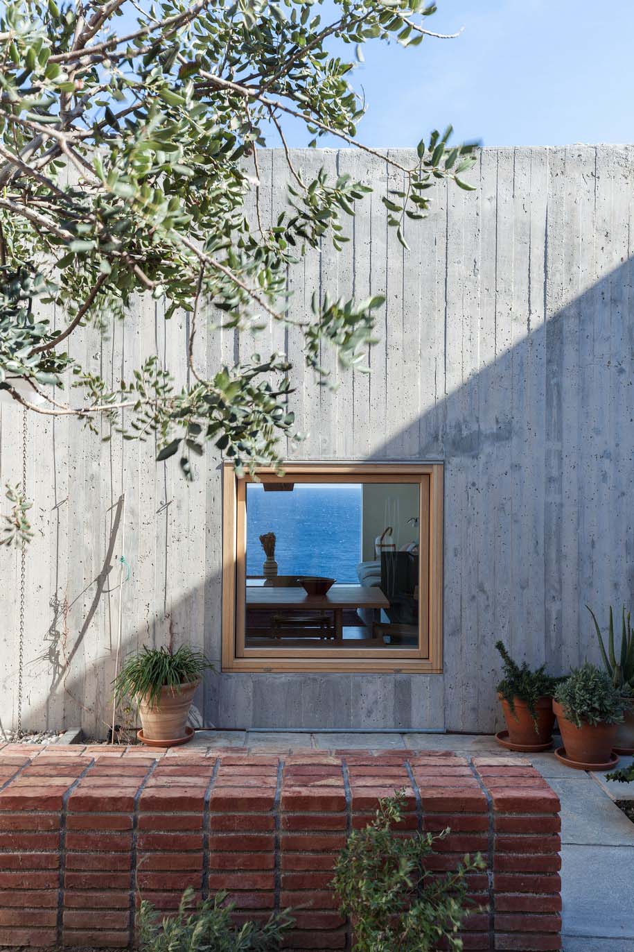 Archisearch OOAK ARCHITECTS designed Patio House on a cliffside in Karpathos