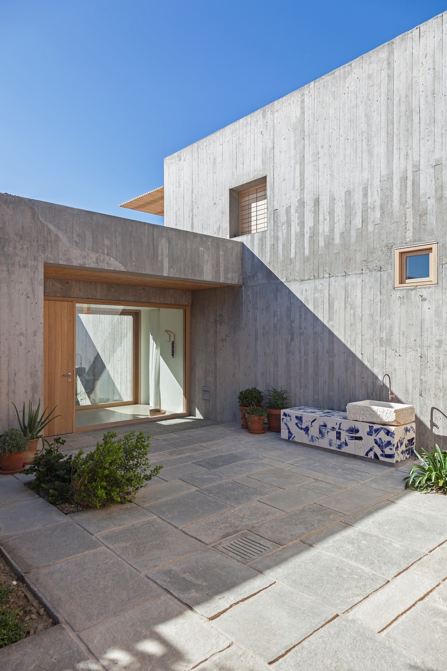 Archisearch OOAK ARCHITECTS designed Patio House on a cliffside in Karpathos