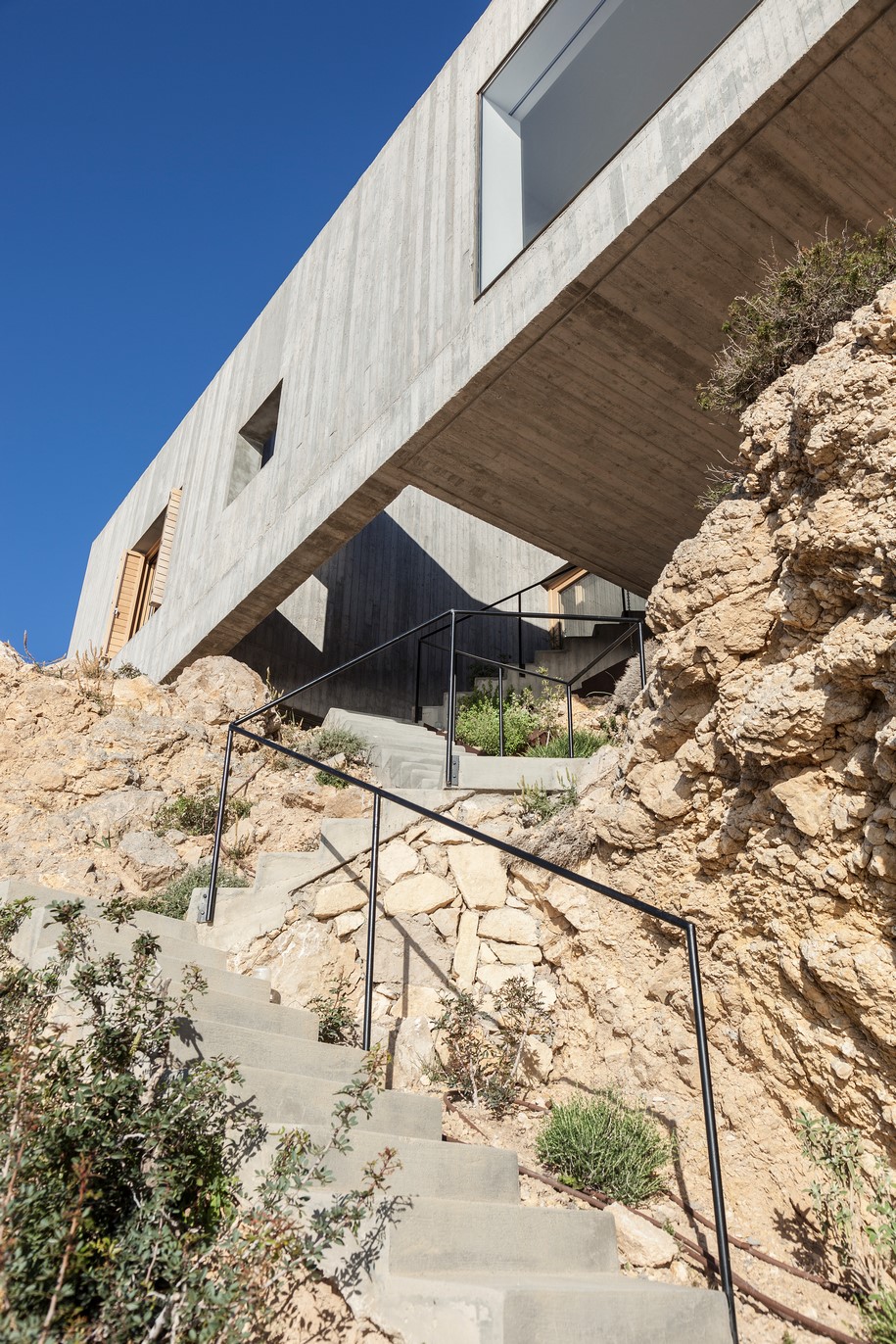 Archisearch OOAK ARCHITECTS designed Patio House on a cliffside in Karpathos