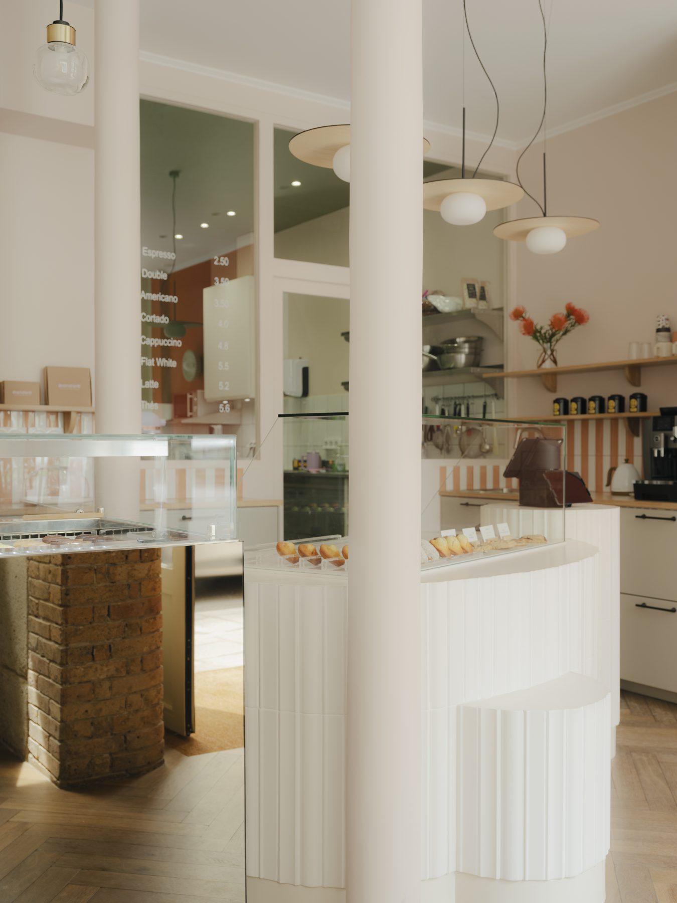 Archisearch Madeleine-Shaped Geometry and a Pink-Orange Palette Define Mandipili by Petit Jour in Paris’ Sentier District
