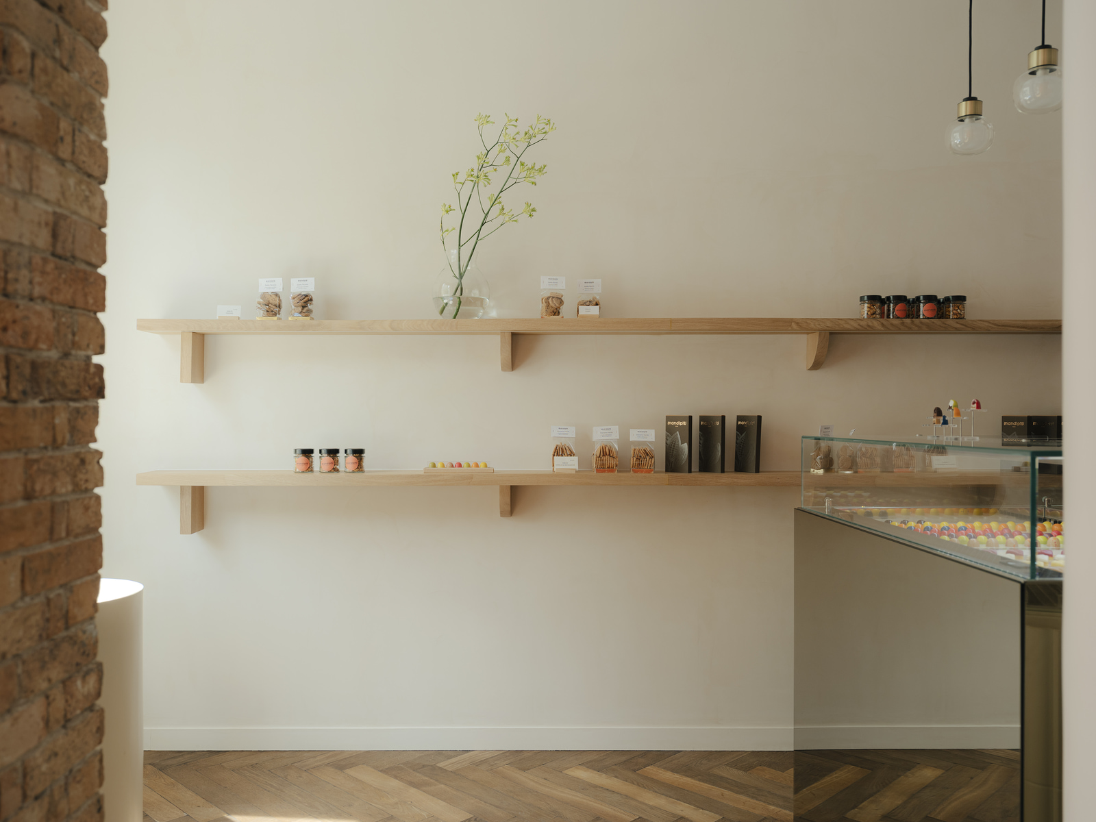 Archisearch Madeleine-Shaped Geometry and a Pink-Orange Palette Define Mandipili by Petit Jour in Paris’ Sentier District