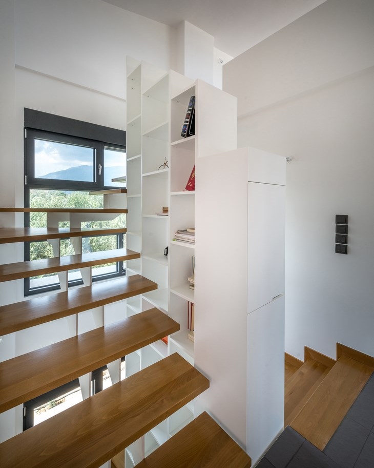 Archisearch - 1st floor staircase view with built-in selves, IS House, Nafpaktos Greece, Barlas Architects (c) Pygmalion Karatzas