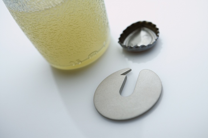 Archisearch - deka - bottle opener - lucky charm for 2010 | photos by giorgos vitsaropoulos