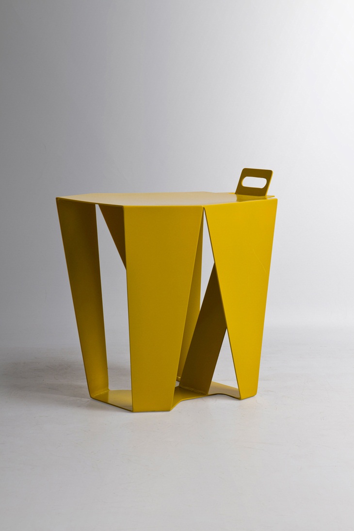 Archisearch - Polistools: A piece of furniture, more specifically a stool has been created from one piece of recyclable metal, in a bent polygonal shape.  The object retains an overall symmetry with perceptual hints of a symmetrical artifact. This means is that the object is open and closed at the same time.