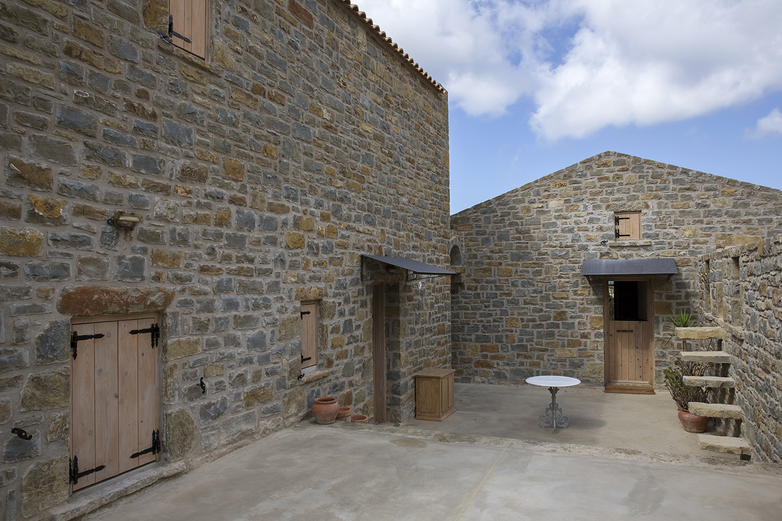 Archisearch Chrysanthé Kastani designs Two Stone Cottages in Messinia.